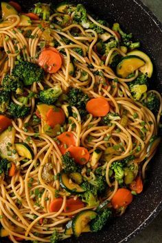 a skillet filled with noodles and vegetables