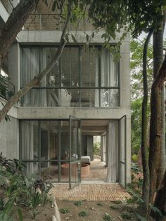 a house that is surrounded by trees and plants