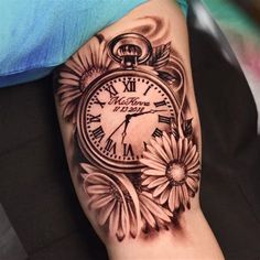 a clock with flowers on the arm and in the background is a sunflower tattoo