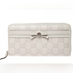 Gucci Guccisima Gg Monogram Embossed Off White Leather Zip Around Long Wallet Measurements Are 7.5"W 4"H Bags Gucci, Gg Monogram, Rebecca Minkoff Mac, Gucci Bags, Long Wallet, 4 H, White Leather, Gucci Bag, Zip Around Wallet