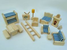 a collection of wooden toys sitting on top of a white table