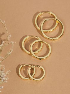 You need this timeless 18k gold dipped huggie hoop set in your everyday earring collection. This set features three different sized classic hoops fit for any occasion. Pair with a sweatshirt to glam up your look or a black dress for a sleek night out look! Gold Hoop Earring Set, Wishlist 2024, Earring Collection, Hoop Earring Sets, Gold Dipped, Everyday Earrings, Accessories Jewelry Earrings, Earrings Collection, Christmas Wishlist