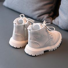 Children's Zipper Leather Boots offer style and added height to your child's outfit! They are classy shoes that have a zipper on the side to help with wear. They come in 3 amazing colors and different sizes to choose from. The details on these boots are fantastic with a dotted stitch design. These boots are a great choice for your child's wear! PRODUCT HIGHLIGHTS: Outsole Material: Rubber Upper Material: PU Gender: Unisex Fit: Fits true to size, take your normal size Season: Spring & Autumn Clos Faux Leather Martin Boots With Zipper Closure, Faux Leather Combat Boots With Zipper Closure, Fall High-top Boots For School, School Boots For Fall With Round Toe, High-top Faux Leather Boots With Zipper Closure, Cute White Boots With Zipper Kids, Leather Toddler Boots, Disney Sneakers, Disney Slippers