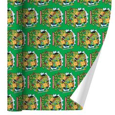 a green wrapping paper with an image of pineapples on it