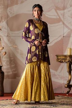 Purple banarasi georgette jacket with circular motifs embroidery. Comes with yellow banarasi brocade sharara and a bustier. - Aza Fashions Anarkali Long Sleeve Festive Outerwear, Long Sleeve Dabka Sharara For Festive Occasions, Gold Long Sleeve Dresses With Gota Work, Festive Long Sleeve Dabka Sharara, Gold Long Sleeve Chanderi Anarkali Set, Gold Anarkali Palazzo Set With Long Sleeves, Festive Long Sleeve Sharara With Gota Work, Festive Gold Palazzo Set With Long Sleeves, Gold Traditional Wear With Gota Work And Long Sleeves