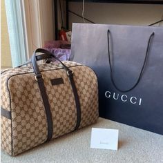 Authentic Gucci. Brand New W/Tag. Never Used! Superb Condition! Canvas W/ Leather Trim. Classic Gc Pattern. Great As An Overnight Bag, Gym Bag Or Carry-On. Fits Under Airline Seats. Comes W/Adjustable Strap And Dust Bag. 16l X 9w X 11h