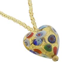 Every woman loves to own unique handcrafted jewelry. This Murano necklace in rich gold and millefiori palette is every woman's dream, rich and beautiful like Venice itself. The authentic Murano necklace features an exquisite 24K gold-layered heart pendant suspended from an elegant gold-lined beaded necklace accented with gorgeous 24K gold-lined and millefiori Murano glass beads. Enjoy this unique Murano Necklace and the aura of Venetian romance and elegance that it projects. Measurements: The he Gold Necklaces With Heart Beads For Jewelry Making, Multicolor Heart Pendant Necklace For Gift, Elegant Multicolor Heart Beads Necklace, Elegant Multicolor Heart Pendant Necklace, Gold Murano Glass Jewelry For Gifts, Gold Murano Glass Jewelry As Gift, Gold Murano Glass Jewelry Gift, Murano Glass Pendant Necklace For Gift, Yellow Murano Glass Jewelry Gift