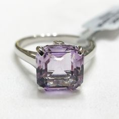 Nwt Pink Amethyst With White Topaz Accents Sterling Silver Ring. Certificate Of Authenticity Size 9 Avg. Metal Wt: 2.85g No. Of Gems: 3 Carat Weight: 5.0100cts (Avg) Length Of Design: 11.00mm X Width Of Design: 10.00mm Pink Amethyst: 4.97 Ct (10mm X 10mm) Origin: Brazil Setting: Prong White Topaz: 2 Round Stones (1.5mm X 1.5mm) Modern Amethyst Anniversary Ring, Round Cut Amethyst Gemstones, Formal Kunzite Jewelry With Prong Setting, Formal White Gold Gemstones, Formal Amethyst Ring In Sterling Silver, Vs Clarity, Formal Silver Kunzite Jewelry, Classic Amethyst Gemstones In White Gold, Classic White Gold Amethyst Gemstones, Octagon Silver Amethyst Ring For Formal Occasions