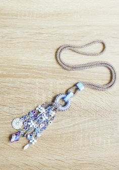 This long necklace is all hand sewn, and made with various kinds of beads. The focal point are the strands, finished with beautiful glass cabochons and a mandala charm. It will be shipped with an organza bag and shipped with a tracking number in a padded envelope. For more necklaces please check: https://www.etsy.com/shop/CinziaDesign?section_id=15986977&ref=shopsection_leftnav_4 My shop: https://www.etsy.com/shop/CinziaDesign?ref=hdr_shop_menu Handmade Bohemian Beaded Lariat Necklace, Handmade Bohemian Lariat Beaded Necklace, Handmade Lariat Festival Necklace, Handmade Festival Lariat Necklace, Bohemian Beaded Lariat Necklace, Bohemian Lariat Necklace With 108 Beads, Bohemian Lariat Necklace With Beaded Chain, Handmade Lariat Necklace For Festivals, Bohemian Long Necklace With Faceted Beads As Gift