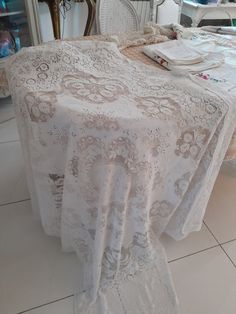 the table is covered with white lace