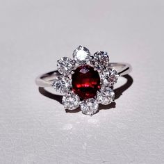 Art Nouveau inspired design which helped me create a majestic and classic piece. Made of solid 18k white gold, adorned with a beautiful natural 1.42 ct pigeon blood ruby and highlighted by 1.35 ct F color and VVS2 - VS1 clarity natural diamonds.  The ring is ready to ship, so if you feel this was made for you, drop us a message with the perfect size and don't forget about the phone number for the courier! The design can be recreated with a gemstones of your choosing. RING MEASUREMENTS: Total wei Luxury Ruby Cluster Ring With Center Stone, Luxury Ruby Gemstone Ring In Platinum, Luxury Cluster Ruby Ring With Center Stone, Luxury Ruby Cluster Ring With Diamonds, Luxury Ruby Ring With Platinum Center Stone, Luxury Cluster Ruby Ring With Diamonds, Luxury Platinum Ruby Ring With Center Stone, Oval Ruby Ring In Platinum For Gift, Oval Ruby Ring In Platinum