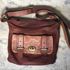 Used In Good Condition With Signs Of Wear Fossil Long Live Vintage Leather Bag 1 Front Bag With Closure Lock 1 Back Bag With Snap Closure Main Bag Wit Zipper 3 Pockets Inside One Zippered *** Please Look At The Last 2 Pictures, The Key Is Broken, And There Is A Little Cut On The Leather On Front *** 11" X 11" X 2" Drop 25" About The Brand: Fossil Group, Inc., Is An American Fashion Designer And Manufacturer Founded In 1984 By Tom Kartsotis And Based In Richardson, Texas. Their Brands Include Fossil, Relic, Michele Watch, Skagen Denmark, Misfit, Wsi, And Zodiac Watches. 21_04.1131/.08- Richardson Texas, Skagen Denmark, Michele Watch, Zodiac Watches, Fossil Crossbody Bags, Brown Crossbody, Vintage Leather Bag, Back Bag, Brown Leather Shoulder Bag