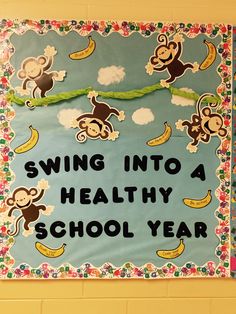 a bulletin board that says swing into a healthy school year with monkeys and bananas on it