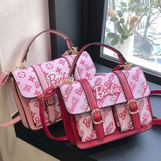 Barbie Crossbody Bag – The Fashion Doll House Trendy Square Bag With Letter Print, Trendy Rectangular Satchel With Letter Print, Pink Rectangular Shoulder Bag With Letter Print, Large Capacity Pink Tote Shoulder Bag, Pink Rectangular Box Bag For School, Pink Rectangular Bag With Adjustable Strap, Pink Large Capacity Rectangular Shoulder Bag, Large Capacity Pink Box Bag For School, Trendy Square Box Bag For School