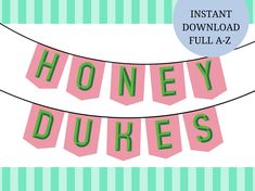 the words honey dukes are hanging from a line with green and pink stripes on it