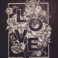 a black and white drawing of flowers with the word love written in it's center