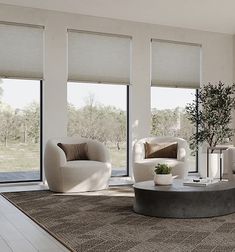 a living room filled with white furniture and windows covered in shades on the outside wall