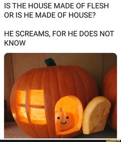 a pumpkin carved to look like a house with a hole in the front and inside