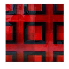 an abstract photograph of red and black squares