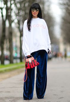 Proof wide-leg trousers are so in right now Velvet Pants Street Style, Velvet Trousers Outfit Casual, Black Velvet Trousers Outfit, Velvet Wide Leg Pants Outfit, Blue Velvet Pants Outfits, Velvet Pants Outfit Winter, Velvet Trousers Outfit, Velvet Street Style, Velvet Outfits For Women