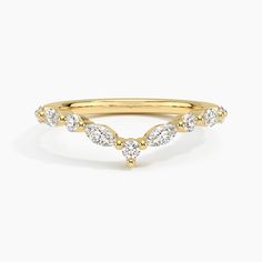 a gold ring with three diamonds on it