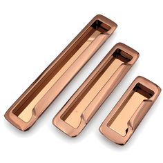 three shiny metal handles on a white background