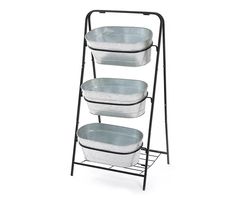 three plastic containers are stacked on a metal rack with black legs and two white buckets