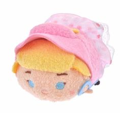 a small doll with a pink hat on it's head