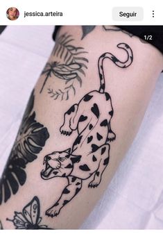 a tattoo on the leg of a person with a black and white dalmatian