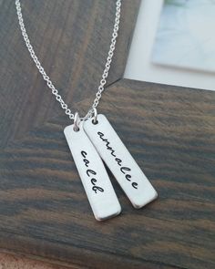 "« Mommy Necklace // Personalized Necklace with Kids Names // Hand Stamped Jewelry // Personalized Name Necklace // Custom Name Bar » If you are looking for the perfect gift for any mom or grandma, this is it! A unique way to carry your loved ones close to your heart! ♥ Each name is carefully hand stamped on a 1.2\" rectangle tag in our gorgeous script font. The rectangles are strung from an 18 inch oval link chain. The rectangles can be personalized with up to 10 characters on each. Please choo Everyday Hand Stamped Rectangular Necklace, Everyday Rectangular Hand Stamped Necklace, Everyday Handmade Rectangular Necklaces, Handmade Rectangular Everyday Necklace, Everyday Handmade Rectangular Necklace, Hand Stamped Rectangular Necklaces For Mother's Day, Simple Hand Stamped Necklace As Gift, Cute Personalized Everyday Jewelry, Cute Everyday Personalized Jewelry