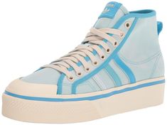 PRICES MAY VARY. Women's classic platform high top shoes made in part with Parley Ocean Plastic FLEXIBLE UPPER: Soft textile upper is stretchy and comfortable PLATFORM MIDSOLE: Platform midsole adds a little extra height and style RUBBER OUTSOLE: The rubber outsole provides outstanding grip and a sleek, low-profile look PARLEY OCEAN PLASTIC: This shoe's upper is made with yarn containing at least 50% recycled polyester and 50% Parley Ocean Plastic. The yarn contains plastic waste from remote isl Adidas Ultra Boost Women, Adidas Platform, Adidas Nmd R1 White, Adidas White Sneakers, Adidas Sneakers Women, Shoes Stand, Adidas Originals Women, Cute Nikes, Adidas Ultra Boost