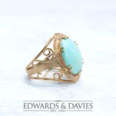 This is a 9k yellow gold antique ring with a large oval natural turquoise stone. The ring is hallmarked Birmingham. The current finger size is 8.  Please indicate whether you require an alternate size at checkout.  *Please allow for 5 additional days if the item requires re-sizing. Item Description: Metal: 9k gold 15.5x12 mm Natural Turquoise Size: US 8 Weight: 4.84 grams  Measurements: Ring Top 22mm and longest point, 6mm highest point off finger, 3.5mm wide bottom band  Condition: Very good Options: Vintage or antique items will show signs of wear.  We can polish the gold at your request, free of charge.  This is purely a preference.  Some people prefer to have vintage items look 'vintage' and some like to have them polished.  The images will always show the ring prior to any polishing o Gold Oval Hallmarked Turquoise Ring, Antique Oval Turquoise Ring Hallmarked, Vintage Yellow Gold Turquoise Ring Hallmarked, Antique Turquoise Ring In Yellow Gold, Antique Yellow Gold Turquoise Ring For Anniversary, Antique Oval Turquoise Ring, Heirloom Style Oval Turquoise Gemstone Ring, Antique Oval Turquoise Ring For Wedding, Antique Oval Turquoise Wedding Ring