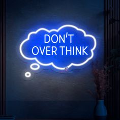 a neon sign that says don't over think