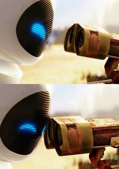 two different views of a robot with blue lights