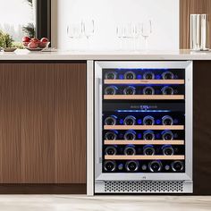 a wine cooler with many bottles and glasses