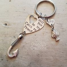 a metal keychain with two hearts and an anchor on it that says, can't be you from here to me?