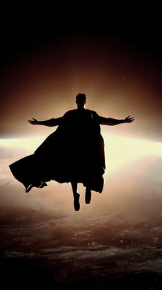 a man is floating in the air with his arms outstretched