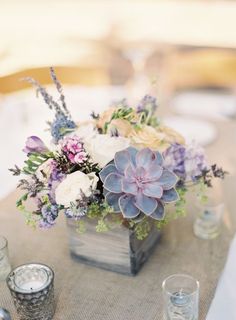 an image of a table setting with flowers and candles on the table for a social post