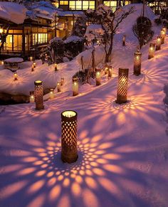 many candles are lit up in the snow