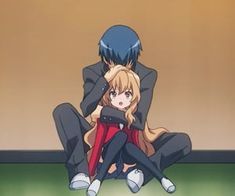 two anime characters sitting on the ground