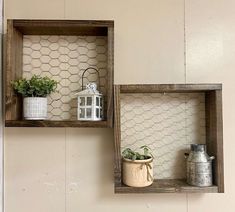 two wooden shelves with pots and plants on them