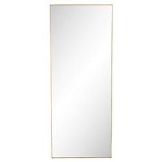 a white mirror sitting on top of a wall