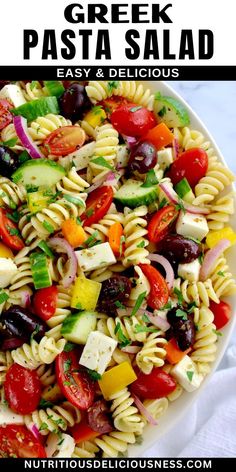 greek pasta salad in a white bowl with the title above it