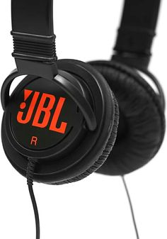 the jbl headphones are black with orange letters on them, and one has a cord attached to it