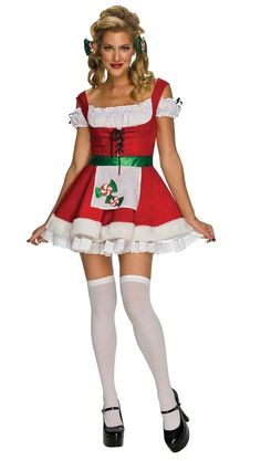 a woman dressed in a christmas costume posing for the camera with her hands on her hips