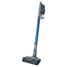 a blue and silver vacuum cleaner on a white background