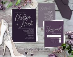 purple and gold wedding stationery with high heel shoes on the table next to it