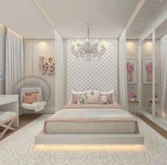 a white bedroom with a chandelier hanging from the ceiling