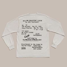 a white long - sleeved t - shirt with information printed on it