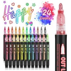 many different colored markers are in front of a white background with the words happy on it